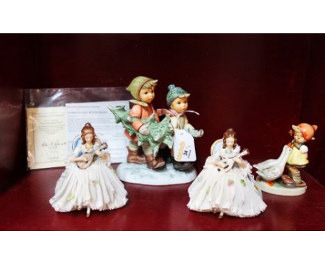 Goebel figurine "Tree Trimming Time", Goebel Goose Girl and two continental crinoline ladies 