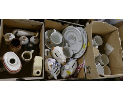 Three boxes of commemorative mugs, Wedgwood Peter Rabbit cups and plates, ceramic pig money boxes, Scotch barrel etc 