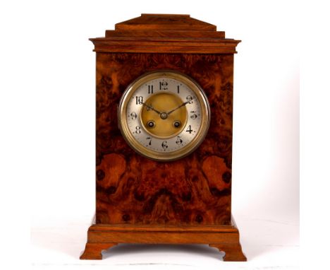 A walnut cased bracket clock, the silver chapter ring with Arabic numerals, fitted a French eight-day movement, 36cm high