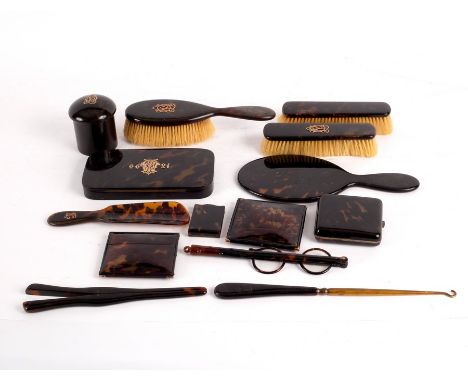 A group of tortoiseshell dressing table items, various CONDITION REPORT: The handles of the hairbrush, mirror and shoe horn h