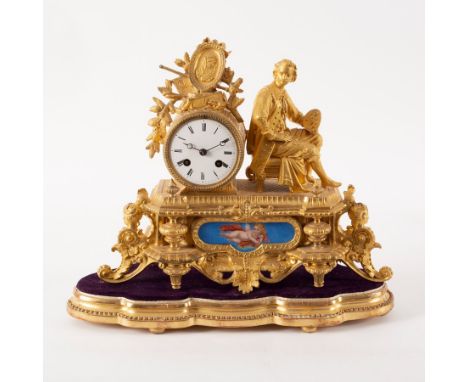 A 19th Century French gilt metal eight-day mantle clock, the case with artist figure at the side of the drum-shaped movement 