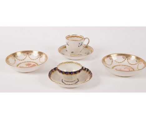 A group of Derby tea wares, circa 1790, comprising a pair of saucers painted in the manner of Zachariah Boreman, a tea bowl a