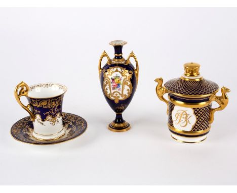 A Royal Crown Derby dark blue ground vase with floral reserve, 13.5cm high, a Coalport blue and gilt coffee cup and a modern 