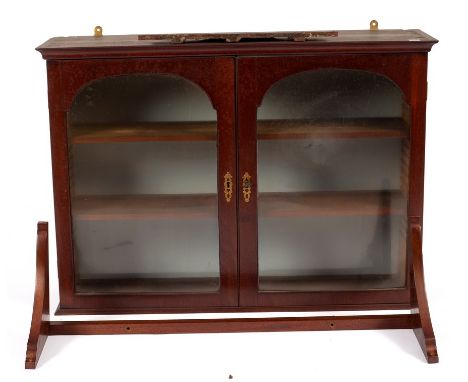 A small mahogany hanging cupboard, enclosed by a pair of arch-top glazed doors and the bracket for the same, 82cm wide