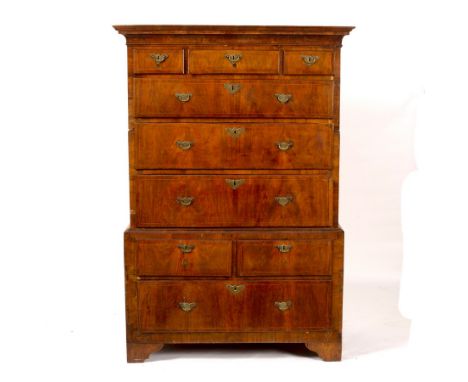 An 18th Century walnut tallboy with moulded cornice, the upper section fitted three short and three long drawers, the lower t