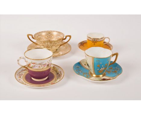 Four Royal Worcester cabinet cups and saucers, comprising a two-handled cup and saucer painted flowers, signed E Phillips, a 