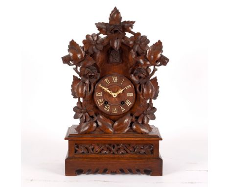 A Black Forest type cuckoo clock, 52cm high CONDITION REPORT: In intermittent working order. Strike operable.