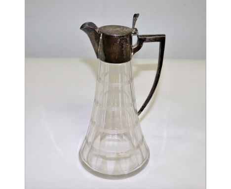 A silver mounted claret jug, William Hutton & Sons. Ltd., Birmingham 1907, the hinged cover crested, 26.5cm high CONDITION RE