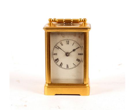 A small carriage clock in a gilt brass case, 13cm high