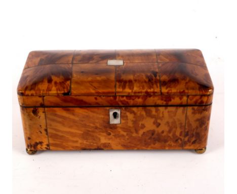 A late 18th Century tortoiseshell tea caddy, the cover with silvered wirework stringing, the interior fitted three compartmen
