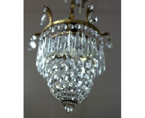 An early 20th Century ceiling light, hung with prismatic drops