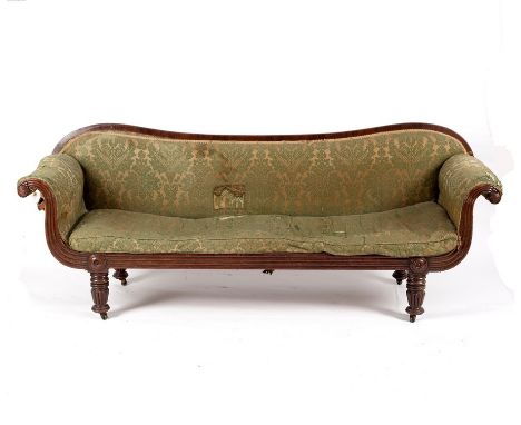 A Victorian mahogany double scroll end sofa raised on turned and reeded legs, 198cm wide