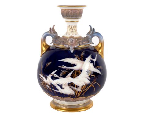 A Royal Worcester blue ground two-handled globular vase, late 19th Century, painted puce marks and impressed marks decorated 