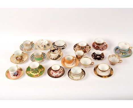 A Flight, Barr & Barr teacup and saucer with gilded decoration on a salmon pink ground, seven other decorative cups and sauce
