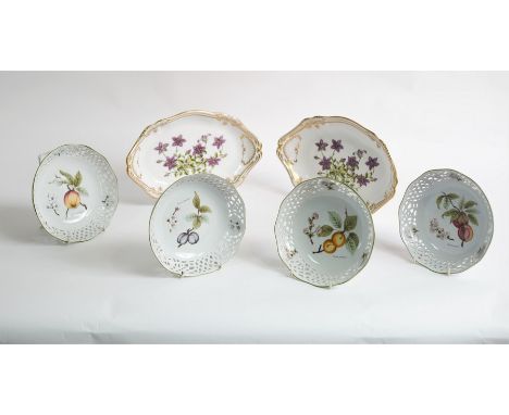 A pair of modern Spode oval dishes, Campanula pattern, highlighted in gilt, 30cm wide and four botanical plates CONDITION REP