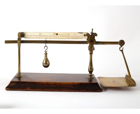A set of 19th Century postal scales by Bloore, to weigh up to four ounces on a wooden base, 33cm wide