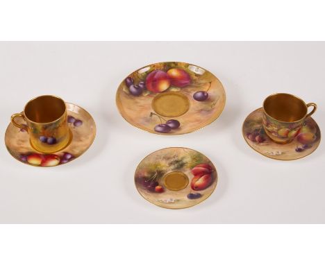 A group of Royal Worcester fruit painted tea ware, comprising a demitasse and two saucers, a larger saucer ensuite painted by