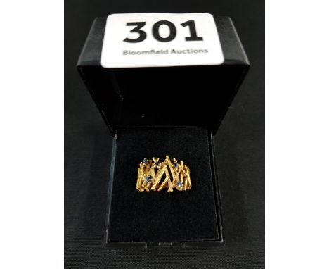 18 CARAT GOLD AND SAPPHIRE DESIGNER RING 6.5 GRAMS 