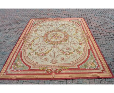 A French style tapestry carpet with centre floral roundel and floral decoration to corners - 290x230cmCONDITION REPORTslightl