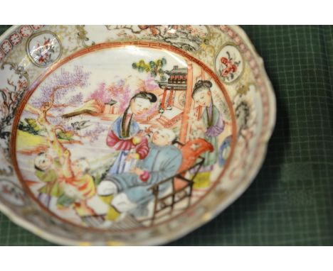 A Chinese style saucer decorated in the famille rose palette, iron red seal mark to base - diam 13cm, together with a Chinese