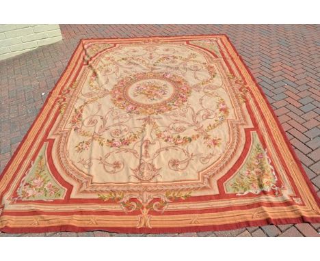 A French style tapestry carpet with centre floral roundel and floral decoration to corners - 365x260cmCONDITION REPORTgood co