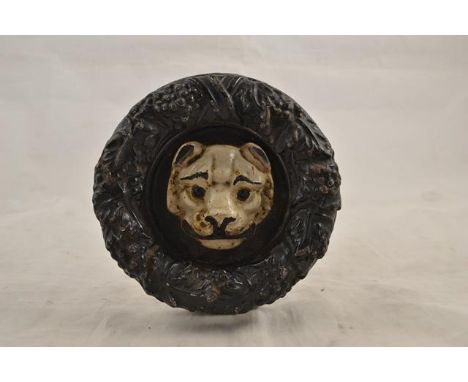 A 19th Century circular door knocker in the form of a dog's head surrounded by a laurel wreath - diam 16cm.CONDITION REPORTsi