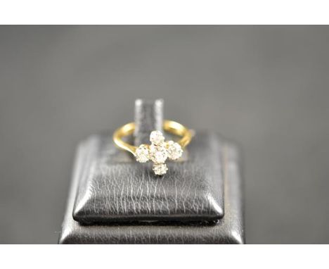 An 18ct gold and platinum ring with five diamonds in cross setting - size K 1/2, approx gross weight 2.9g.CONDITION REPORTGoo