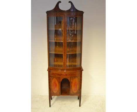 A late 19th/early 20th Century bow fronted mahogany display cabinet, painted with garlands and classical figures, glazed door