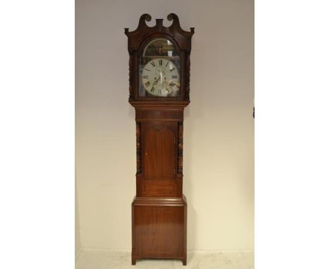 An early 19th century mahogany longcase clock - swan neck pediment to hood, painted arched dial inscribed W Travis, Leek, eig