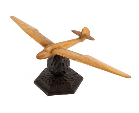 A 1920s German Gliding Trophy Of beech on a black forest carved base31.5cm wingspan x 10cm highgenerally good condition with 