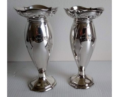 A pair of Art Nouveau silver vases with pierced rims and stylized decoration by Harrison Brothers &amp; Howson, Sheffield, 19