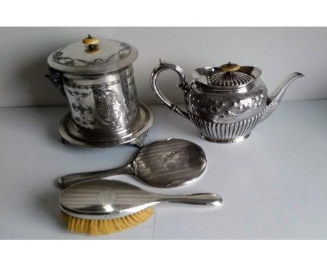 A George V silver backed mirror and brush with engine turned design, mixed dates; a Victorian silver plated teapot and biscui