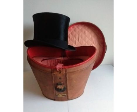 A silk top hat, 21 x 16.5 cm inside circumference by Alexander McLennan, Cheapside, London in original fitted leather box, no