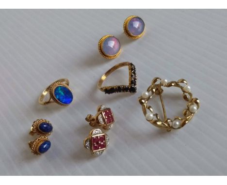 An oval blue opal gem-set ring with beaded decoration, size M; a pair of lapis lazuli earrings; a pair of jelly opal earrings
