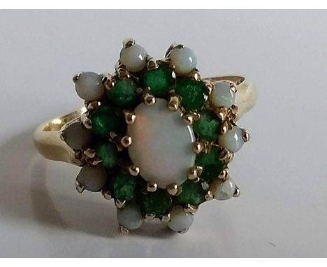 A Victorian opal and emerald cluster ring in a 9ct yellow gold cage setting and loop, size Q, hallmarked, 4g 