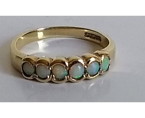 A six-stone 9ct gold opal ring, size O, shank cut, hallmarked, 2.58g 