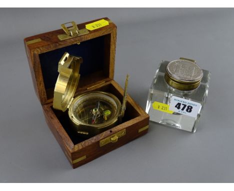 Vintage glass inkwell with 'Conway Coin' top and a reproduction brass compass marked 'Stanley, London' in a wooden box