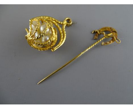 Nine carat gold pendant ball filled with cultured pearls and a nine carat gold horseshoe stick pin, 10 grms gross