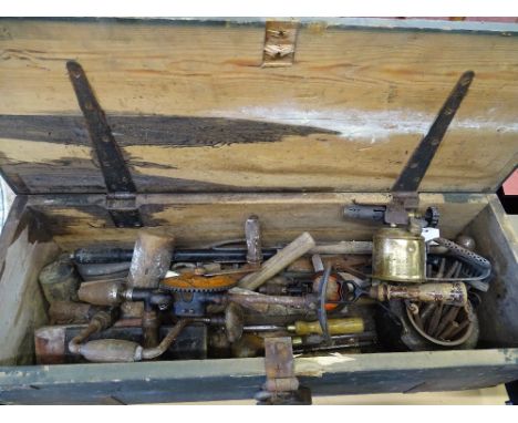 Vintage wooden box with vintage hand tool contents