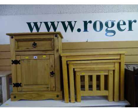 Small pine storage cupboard with single drawer and base cupboard door with black metal fixings and a nest of three light wood