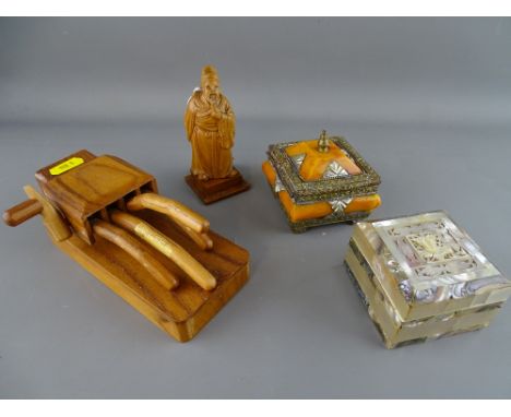 Carved Oriental wooden figure, mother of pearl decorated box and one other and a carved wooden wind-up automaton hand