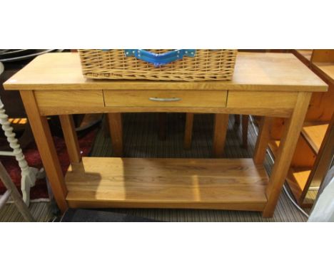 A light oak console table with one small drawer and open under tier,&nbsp; 117cm wide x 35cm deep x 74cm high