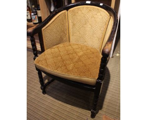 A single wooden bobbin turned armchair upholstered in mustard fabric