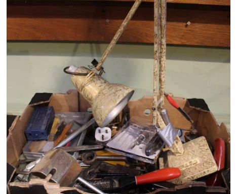 A box of tools and an anglepoise style lamp