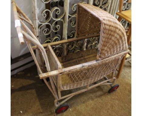 A vintage wicker Child's dolls pram