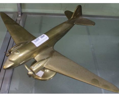 A desk top brass mounted model of a twin engine aircraft