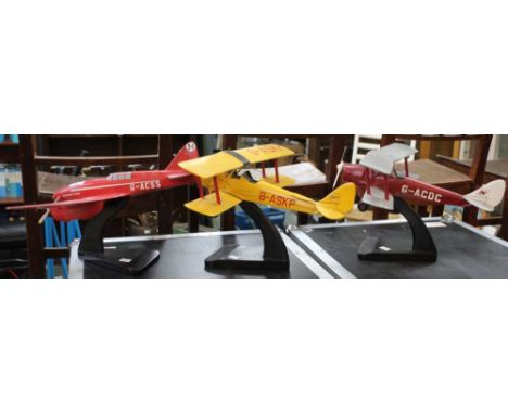 A scale model of a Tiger Moth together with two similar examples,&nbsp;
Red bi-plane: wingspan 43cm x 36cm long
Yellow bi-pla
