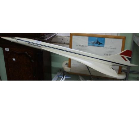 A scale model of Concorde on stand, together with a flight certificate, tip to tip 85cm, wingspan 35cm, some dirty marks, som