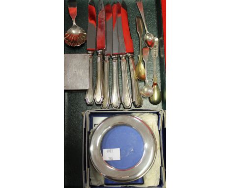 A Georgian silver caddy spoon, tea knives, photo frame, etc.