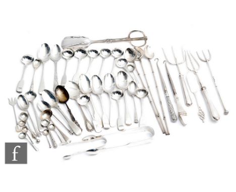 A parcel lot of assorted hallmarked silver and white metal flatware to include tea, mustard and salt spoons, button hook, ton